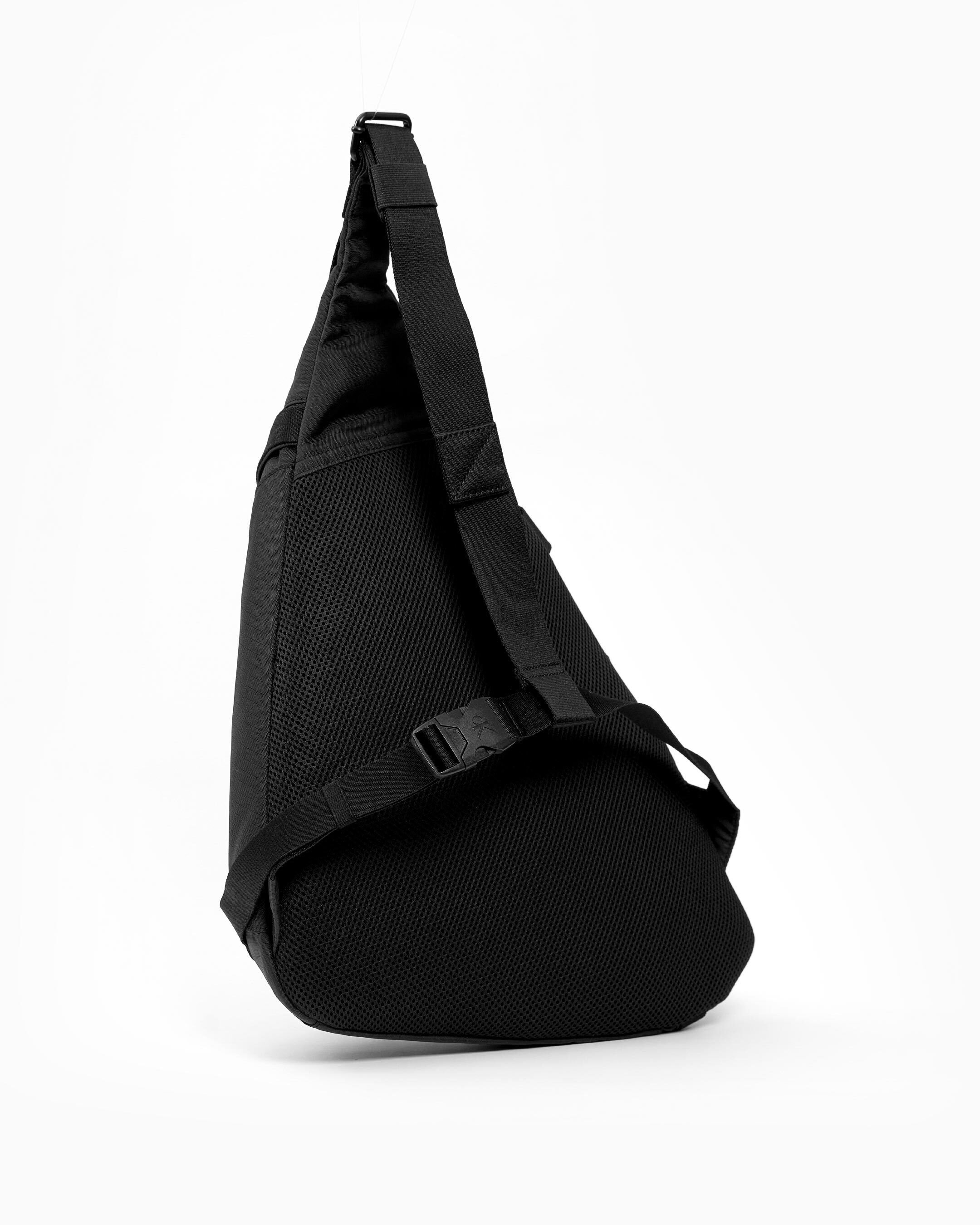 Calvin klein round signature crossbody hotsell