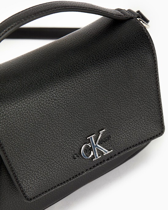 MINIMAL MONOGRAM CAPSULE FLAP CROSSBODY BAG