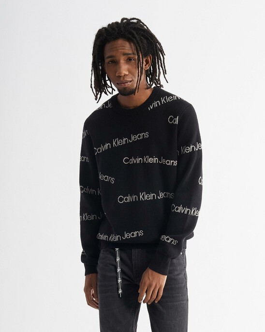 INSTITUTIONAL ALL OVER LOGO SWEATER